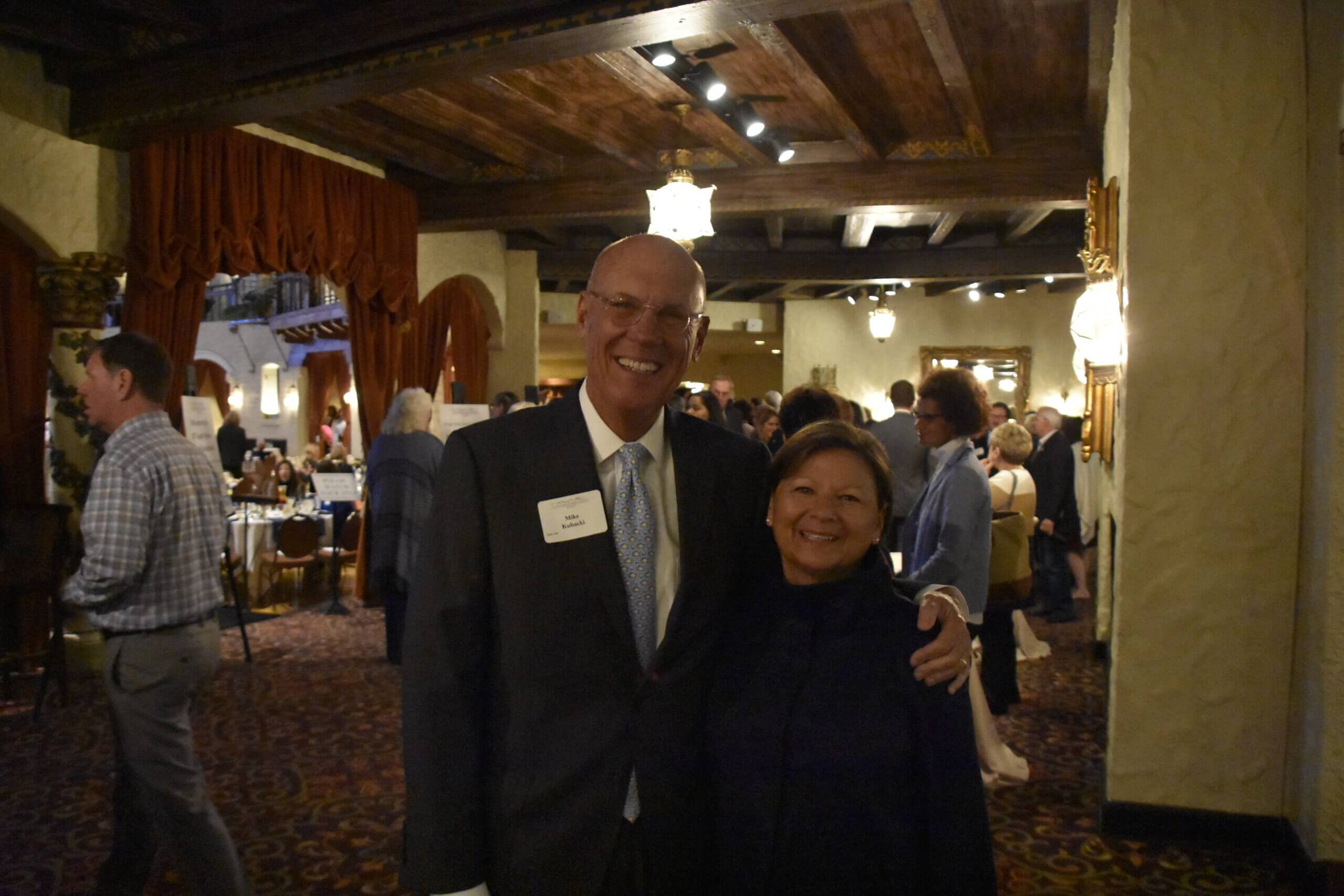 A man and a woman pose for a picture at the Lugar Series event