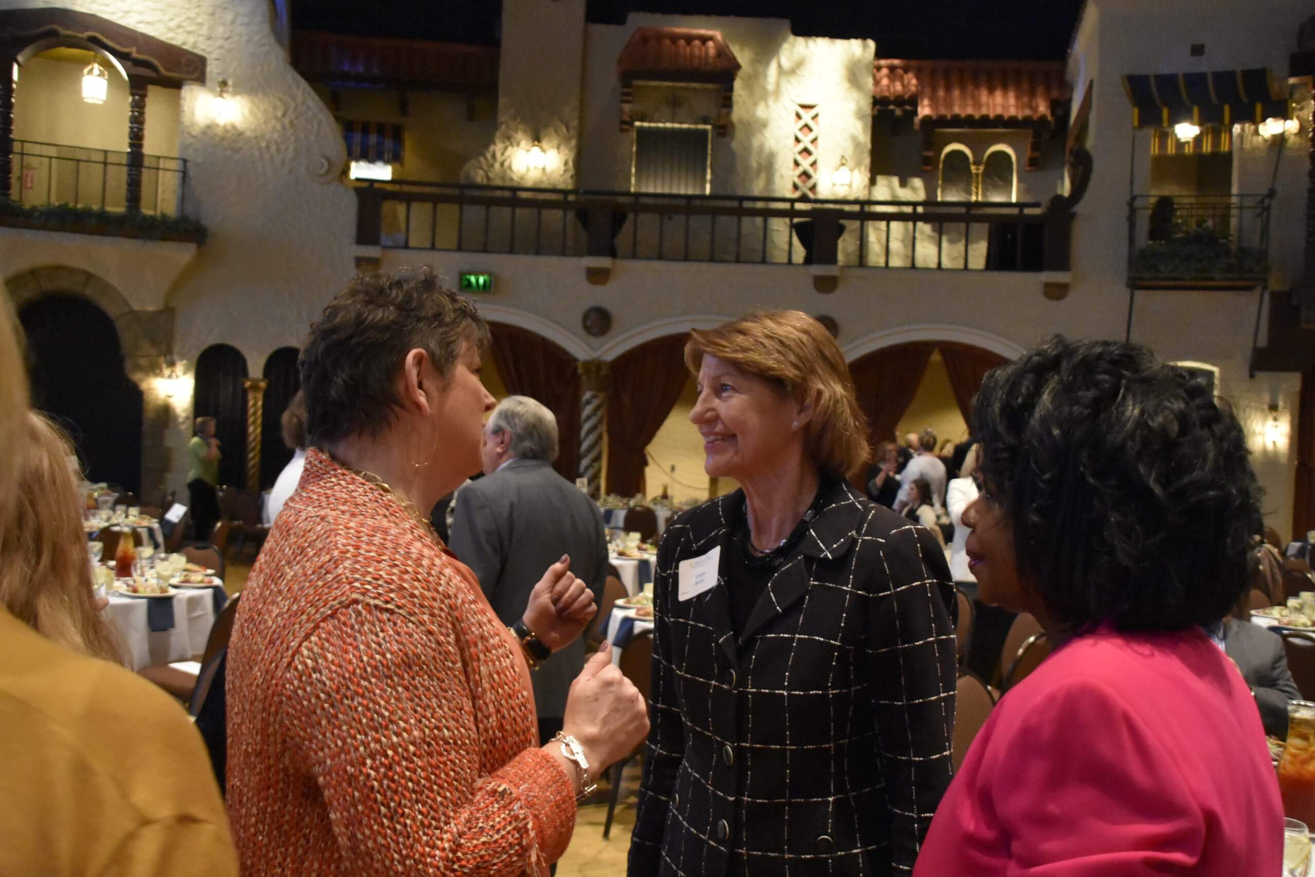Three women have a conversation at the Lugar Series event