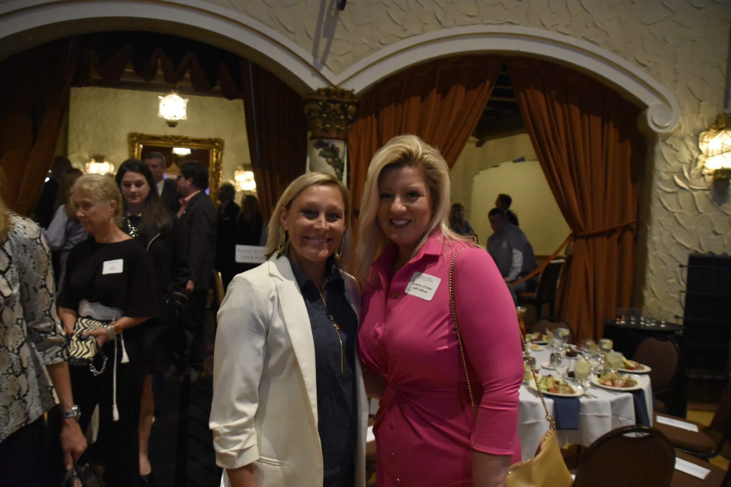 Then-Secretary of State Holli Sullivan poses with a woman at the Lugar Series event