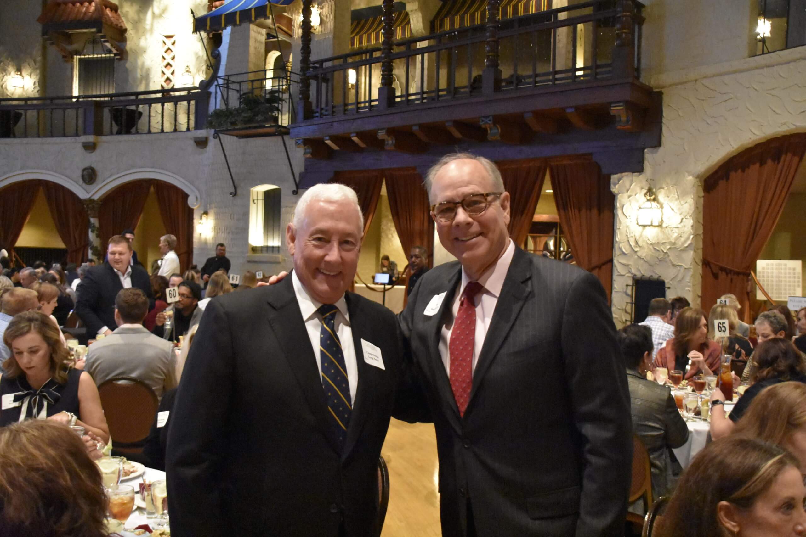 Two men pose together at the Lugar Series event