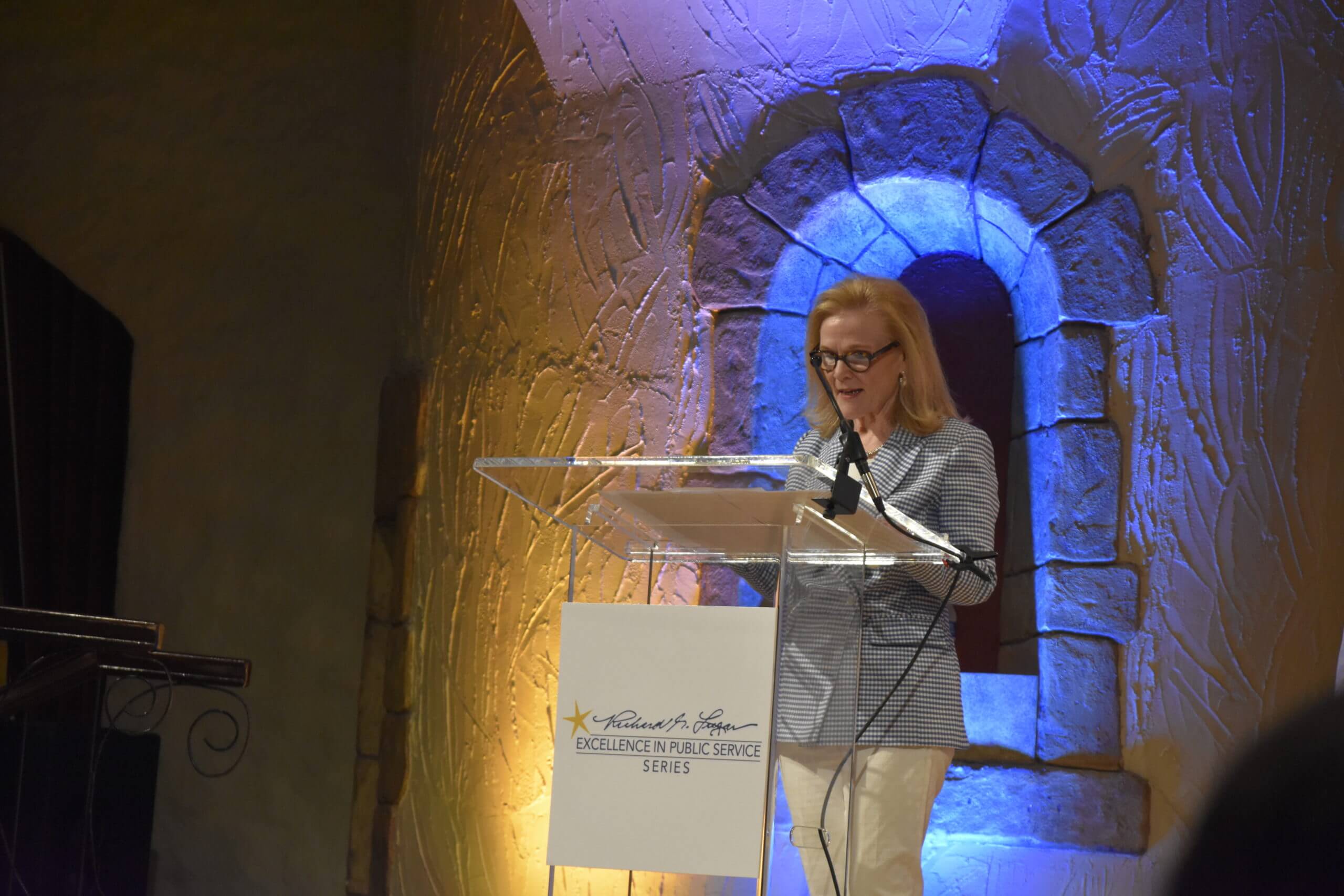 Lugar Series Co-Founder Teresa Lubbers speaks to the crowd