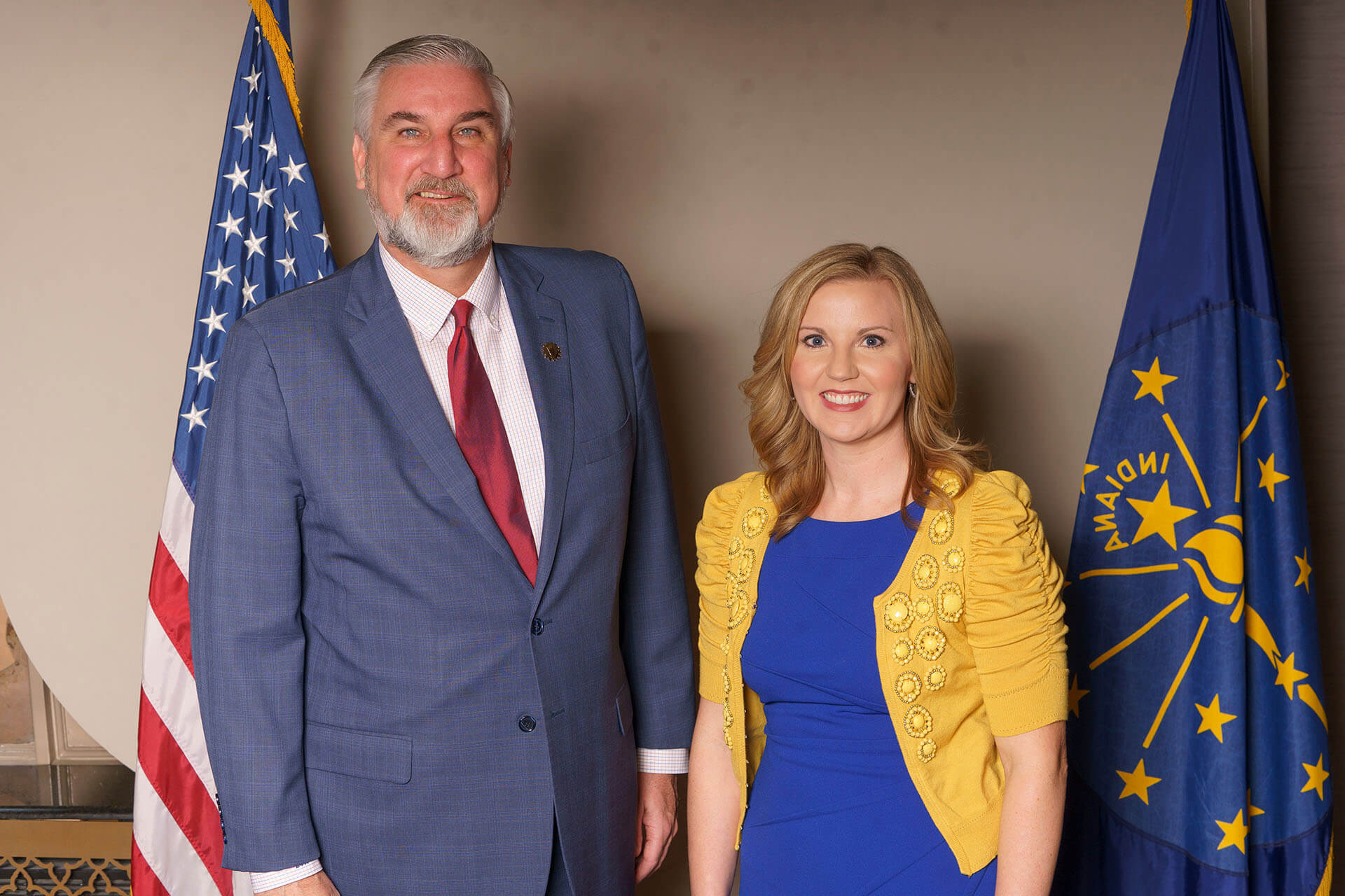 Smiling Lugar Series member wearing a blue dress with featured speaker