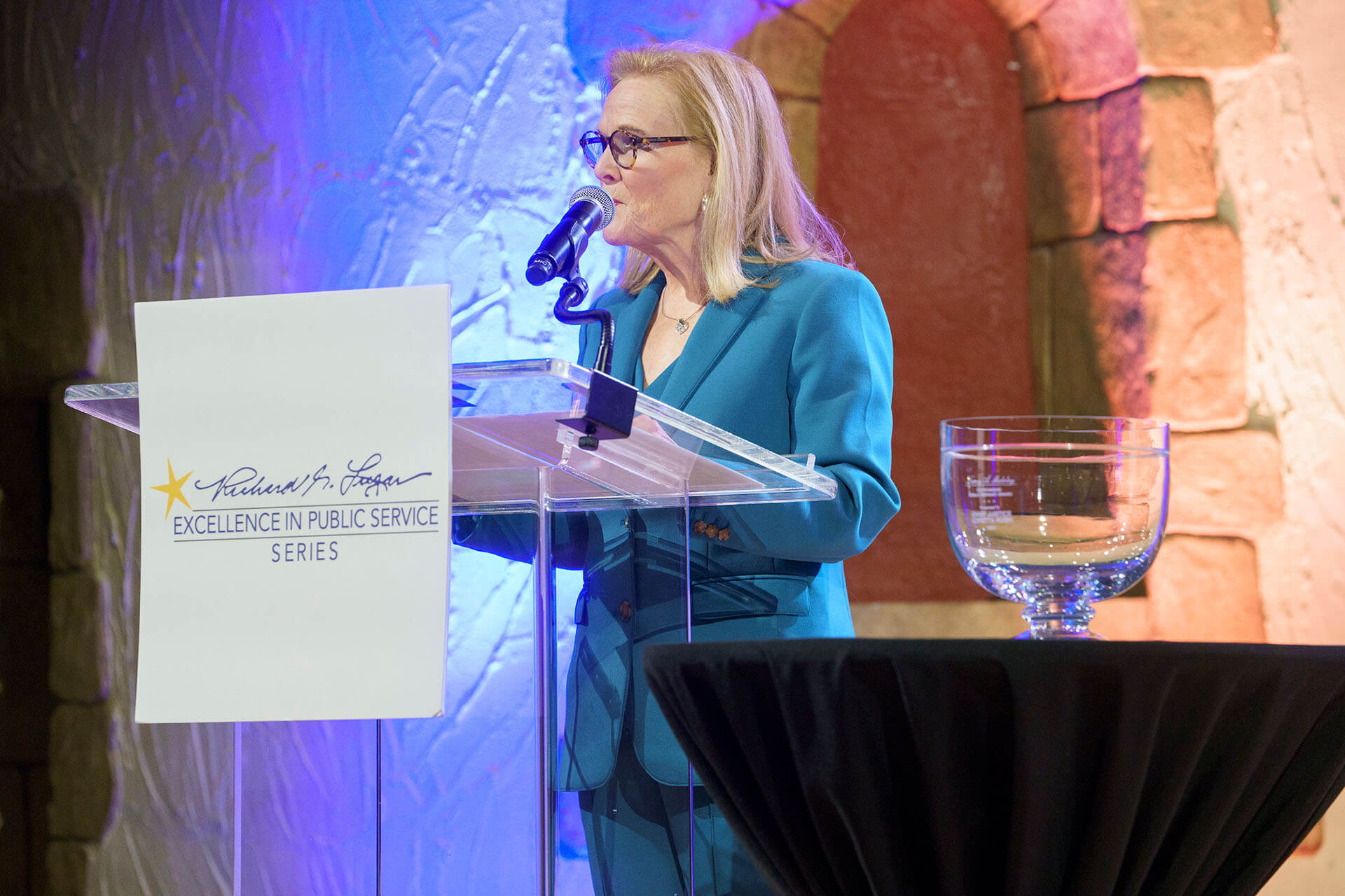 Lugar Series Co-Founder Teresa Lubbers speaks to the crowd at the Annual Luncheon