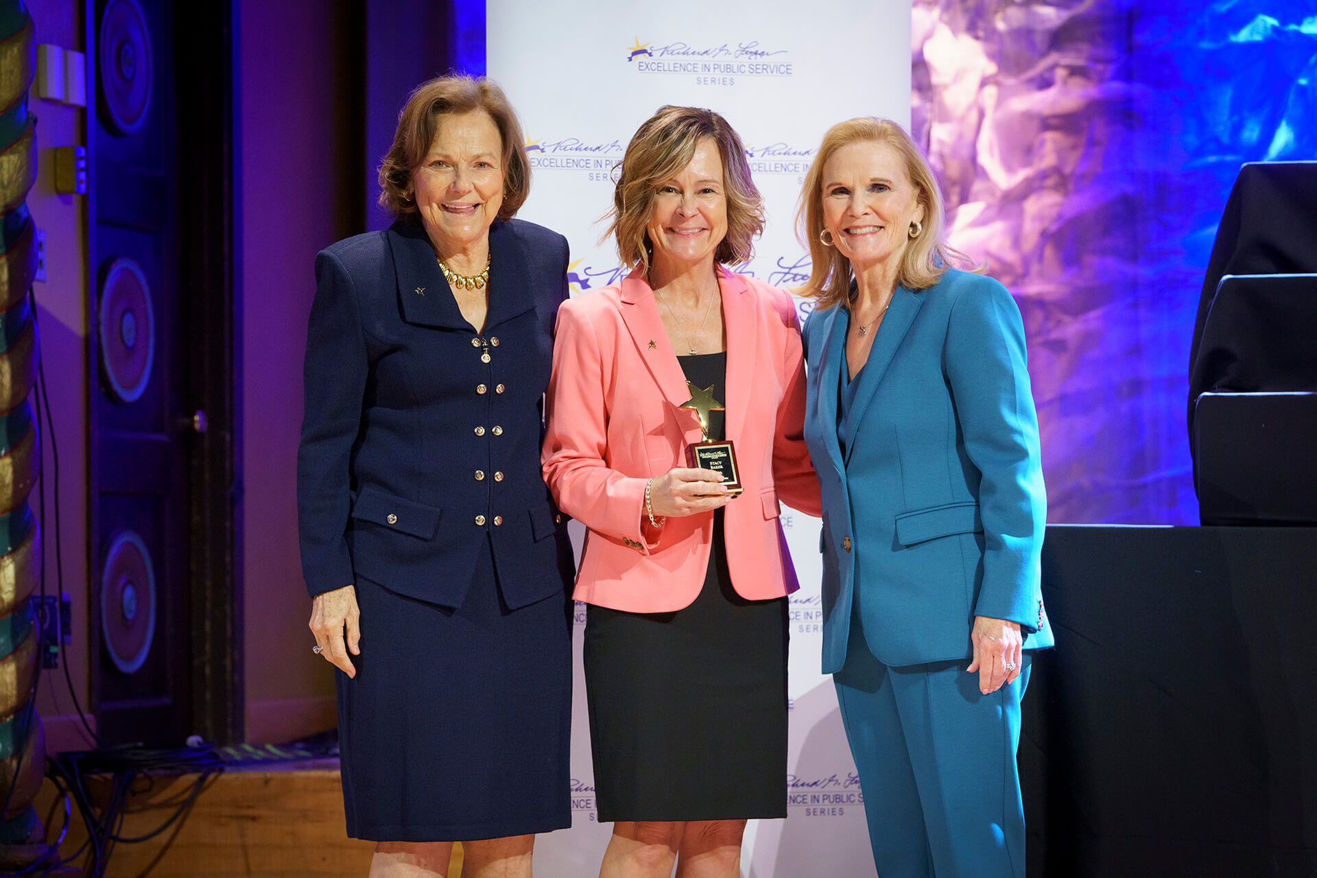 A Lugar Series member is presented with an award