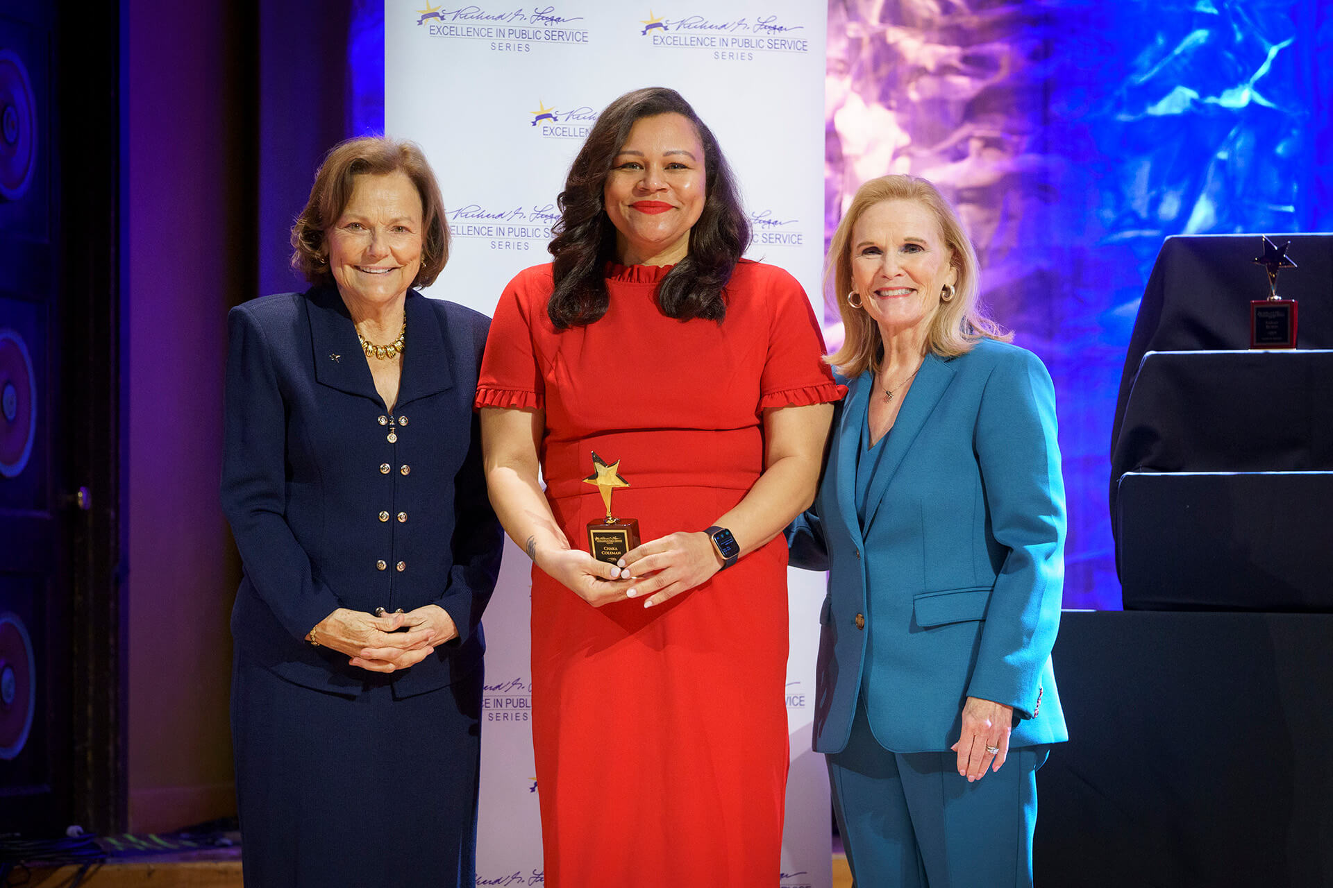 A Lugar Series member is recognized on stage