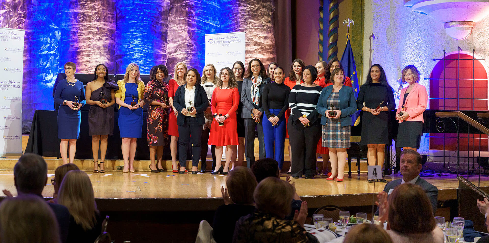 Lugar Series members are honored on stage at the Annual Luncheon