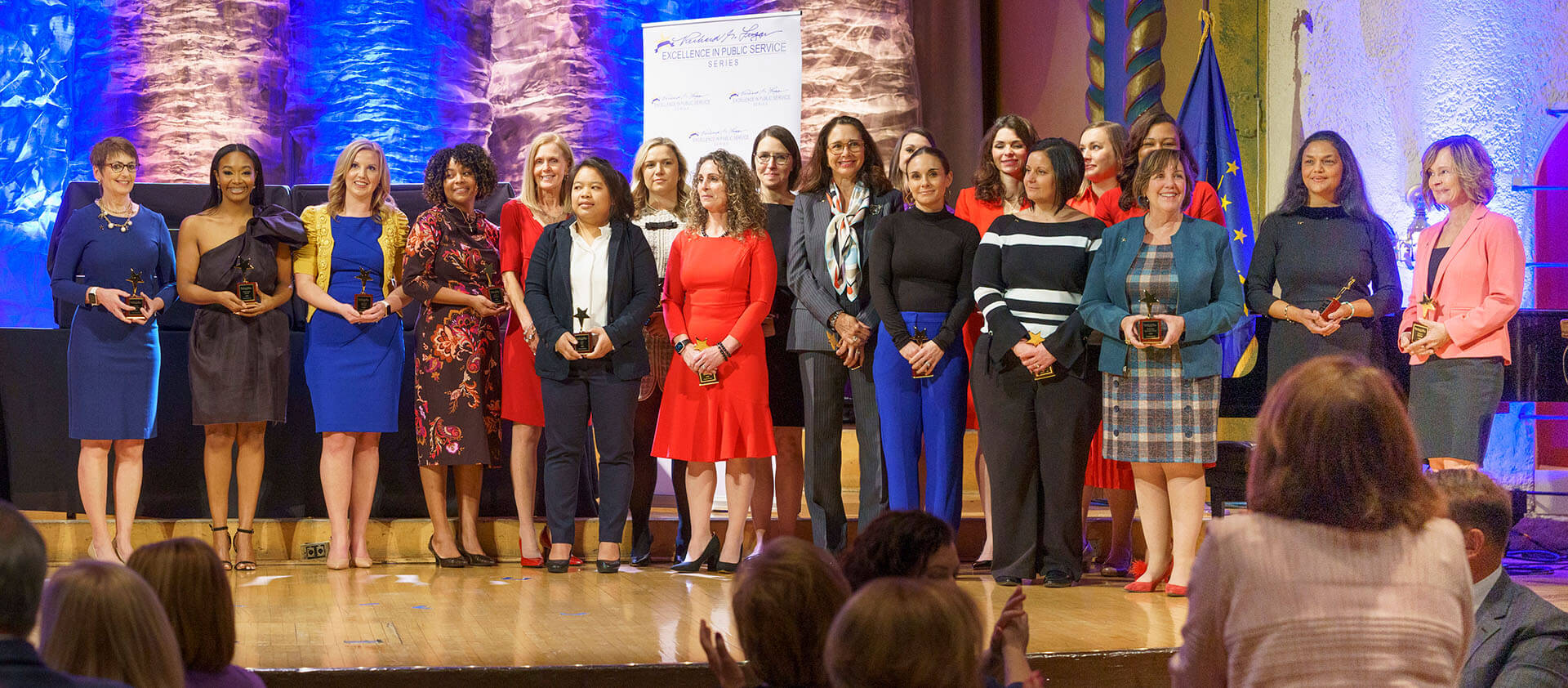 Lugar Series members on stage at the Annual Luncheon