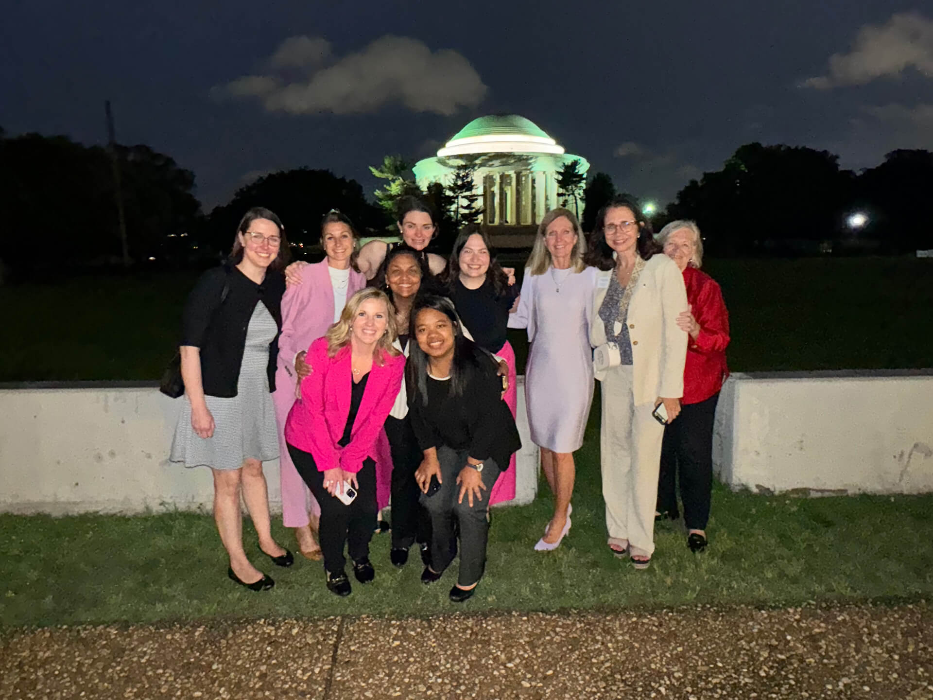 Women of the Lugar Series pose in front of the Thomas Jefferson Memorial