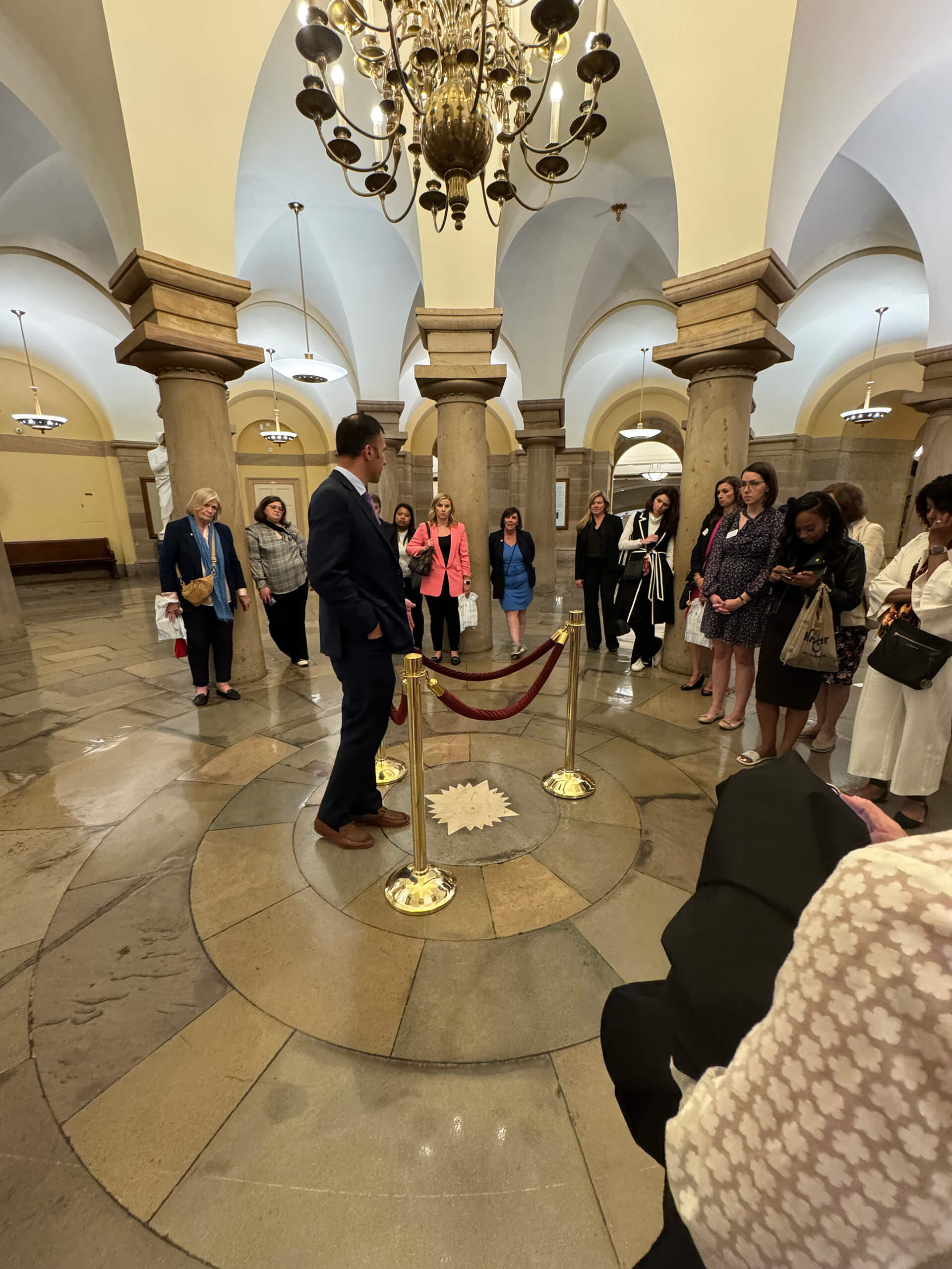 A man speaks to Lugar Series members in the Capitol Crypt