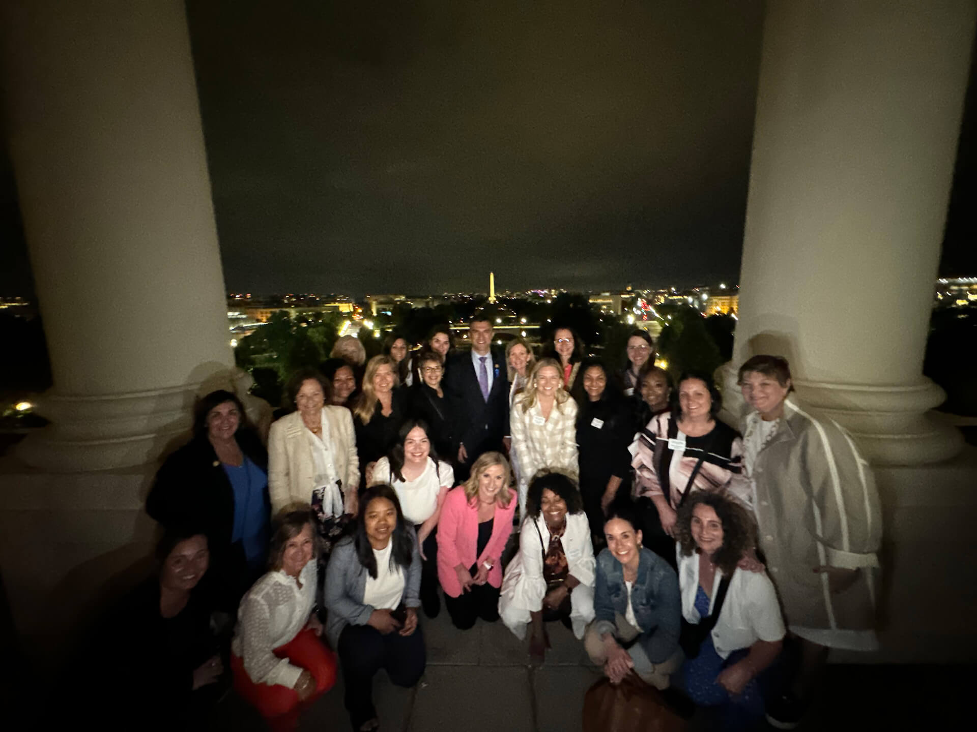 Lugar Series members in front of a scenic view of the National Mall