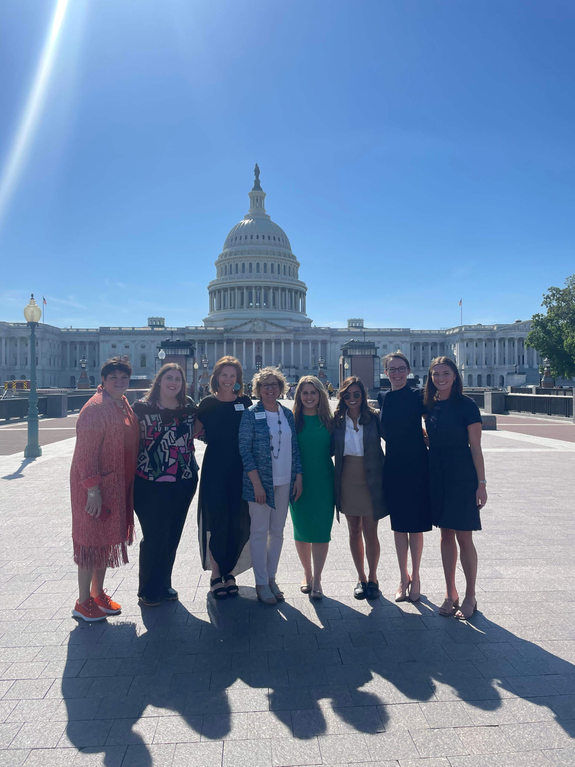 Small Lugar Series group stands in front of U.S. Capitol