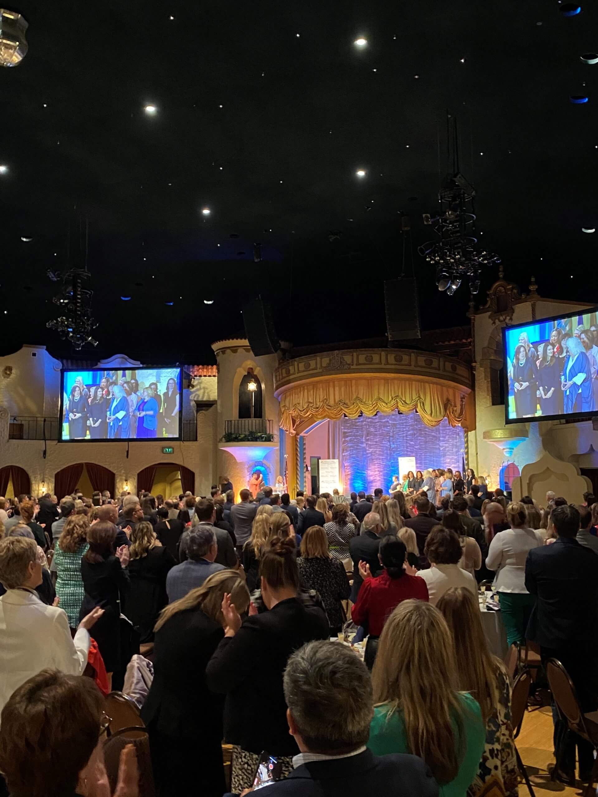 Lugar Series event attendees clap